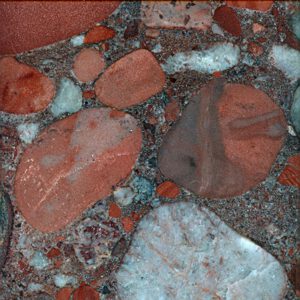 Red stone with chunky mineral patterns