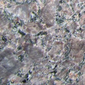 Rose granite with dark minerals